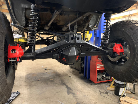 Custom axle truss’, spring hangers, and frame mounts